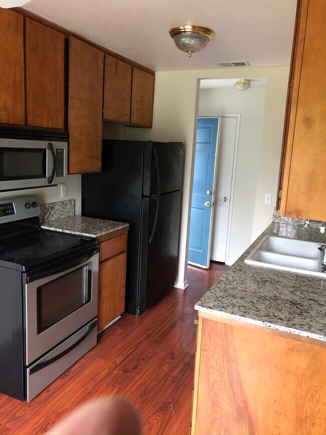 Kitchen with microwave, dishwasher, garbage disposal, and fridge - 445 Almond Dr. #29 Unit Cambridge Place