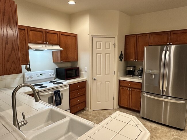 Kitchen and refrigerator - 1709 SW 171st Ter