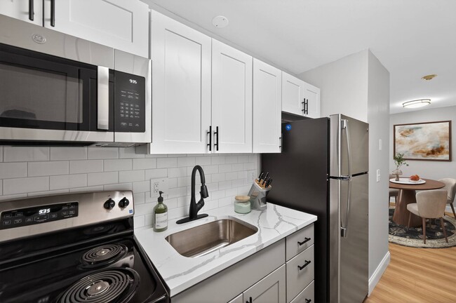 Elevate your living with the modern kitchens at Eagle Rock Apartments at Hudson. Enjoy sleek appliances, stylish cabinetry, and ample counter space for all your culinary needs. Make this space your own—schedule a tour today! - Eagle Rock Apartments at Hudson