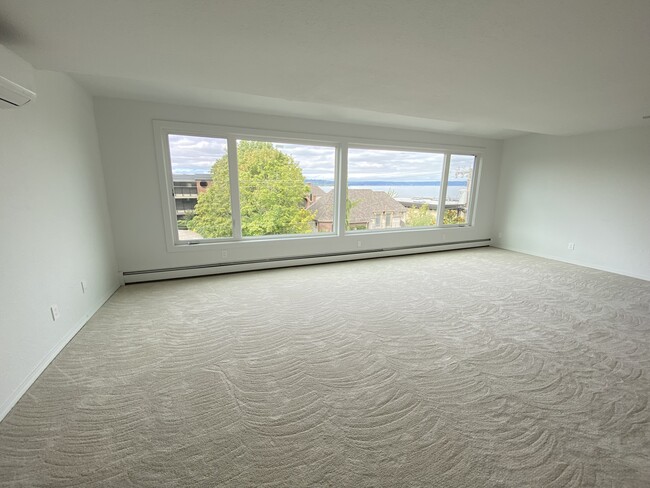 Immense master bedroom with lakeviewter - 714 1st St S Apartments Unit C Rooftop Lake View