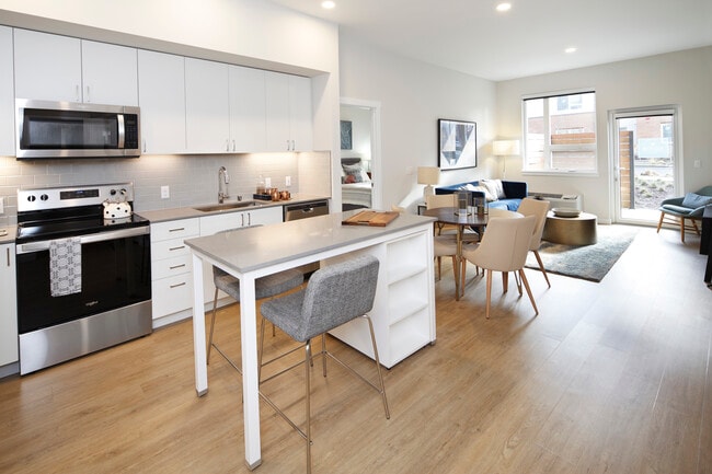 Phase II - Scheme C Kitchen, living, and dining areas with hard surface flooring - Avalon Newcastle Commons