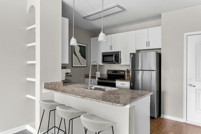 Experience the elegance of this modern kitchen, perfect for culinary creativity.