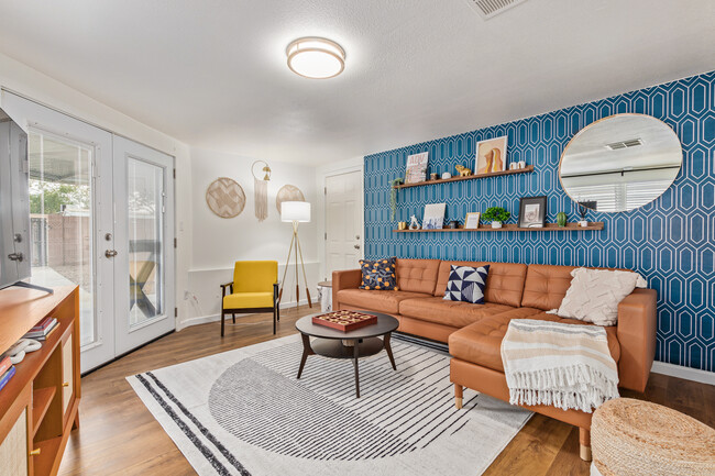 Spacious living room with sectional and TV - 1929 E Indianola Ave House