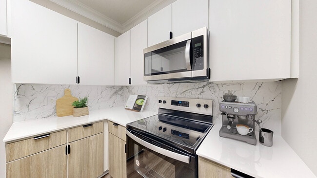 Kitchen with newly renovated amenities - Waterstone at Big Creek Apartments