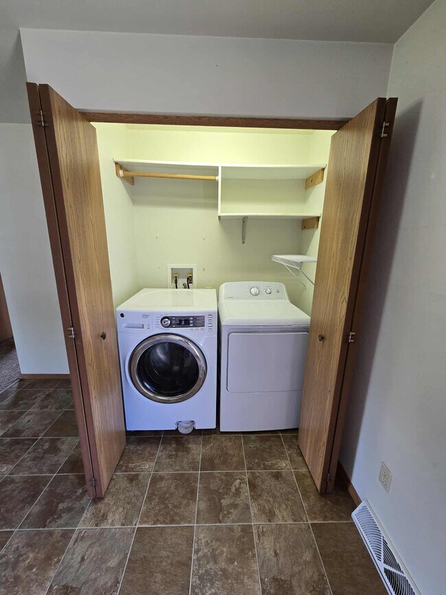 Townhouse (2 bdrm with 2.5 car garage, yard, private basmnt)