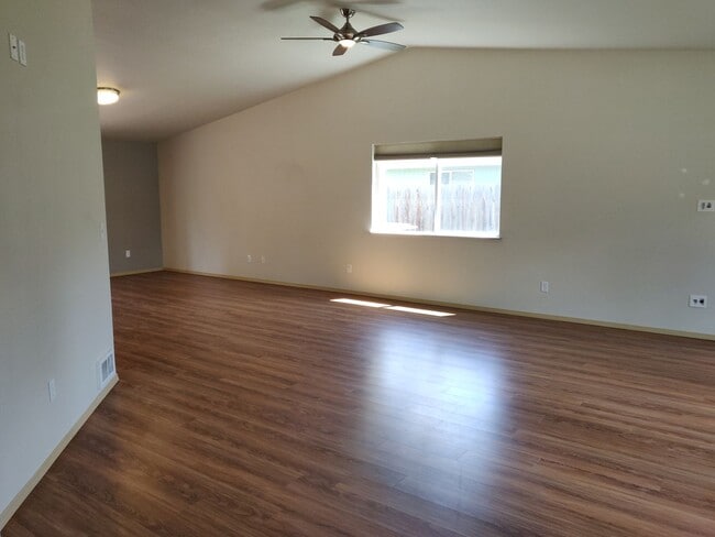 Photo - Charming 4-Bedroom Home on 1/2 Acre with a Fenced Backyard, Fully Insulated Double-Car Garage, in...