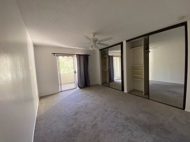 Large bedroom w/patio access - 1935 Alpha Rd Unit 207