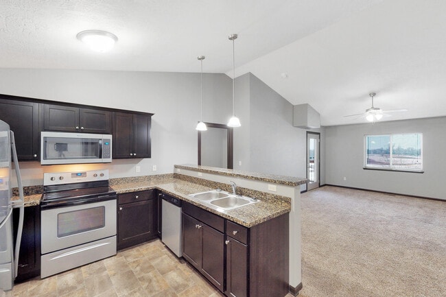 Cocina y sala de estar - Village at Three Fountains