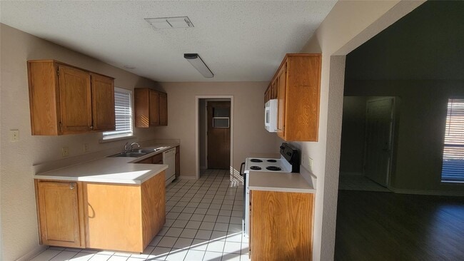 Photo - Discover this inviting 3 bedroom, 2 bathroom rental nestled in Cleburne, Texas, offering a spacio...