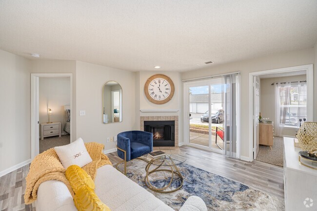 Living Room with Fireplace and Woodgrain Flooring - Reserve at Hamburg Rental