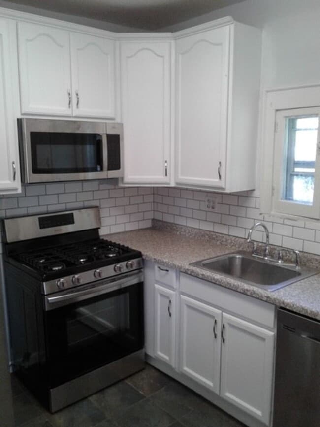 Photo - Beautiful 3 bed / 1 bath home on corner lot with attached garage in quiet Sparta neighborhood!