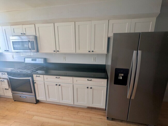 Photo - Your New Home In Point Breeze - 3br/1.5ba with wood flooring, granite counter tops, steel applian...