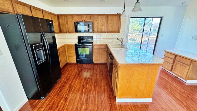 Photo - Large Deck & Fenced Backyard in this Lovely 3 Bed 2 Bath 2 Garage Home in Stone Ridge Park!!