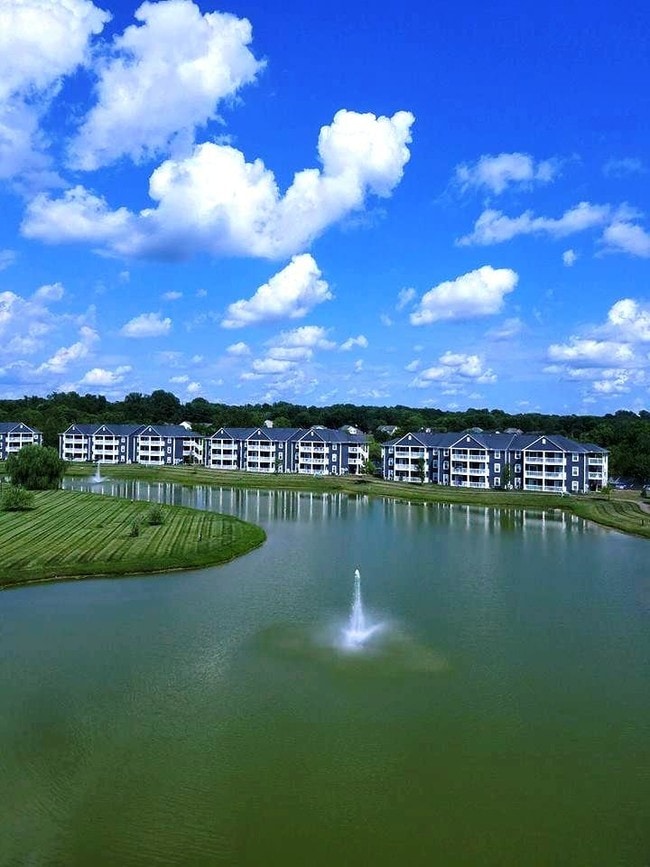 Beautiful Grounds with Lake - The Village at Cloud Park Apartments