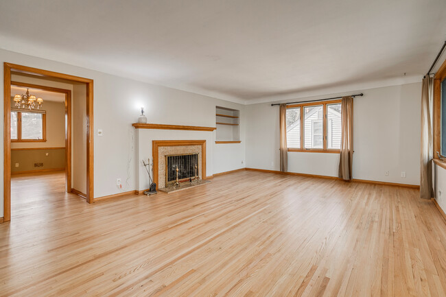 Large open living room with lots of natural light. - 5707 Goodrich Ave House