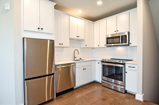 Kitchen featuring high-end finishes - 7227 Georgia Ave NW Unit A