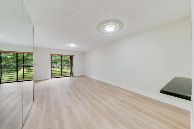 Building Photo - 14847 SW 104th St Unit 10-203