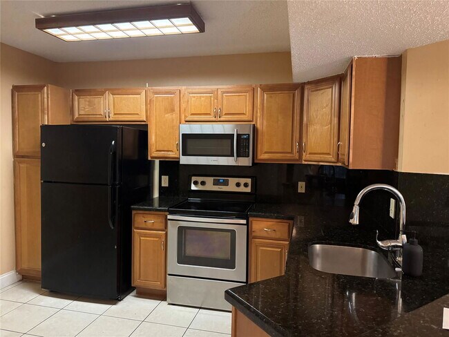 Photo - 9001 Wiles Rd Unit 305