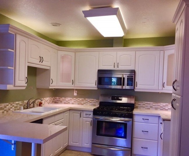 Remodeled kitchen has stainless steel applian - 24713 Masters Cup Way