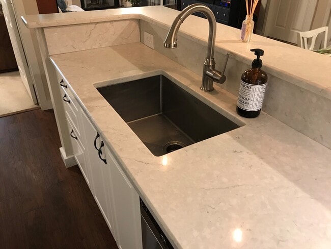 Quartz counter tops and large extra depth stainless steal sink. - 3313 Wyndham Cir Unit 3203