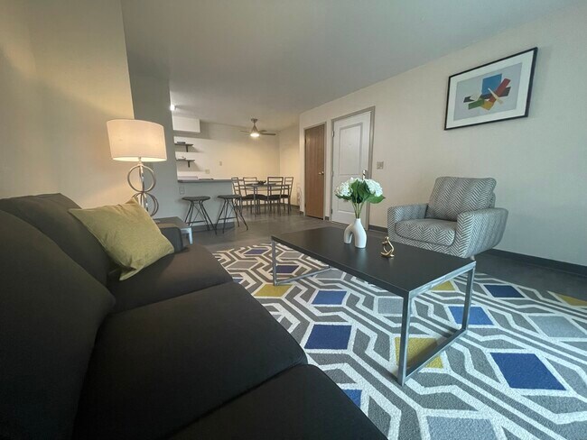 Living Room, Dining Area, and Kitchen - Pine Woods Apartments