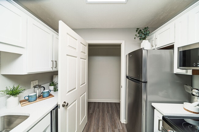 Kitchen with granite counters, modern cabinetry, and stainless appliances - Vetra Providence