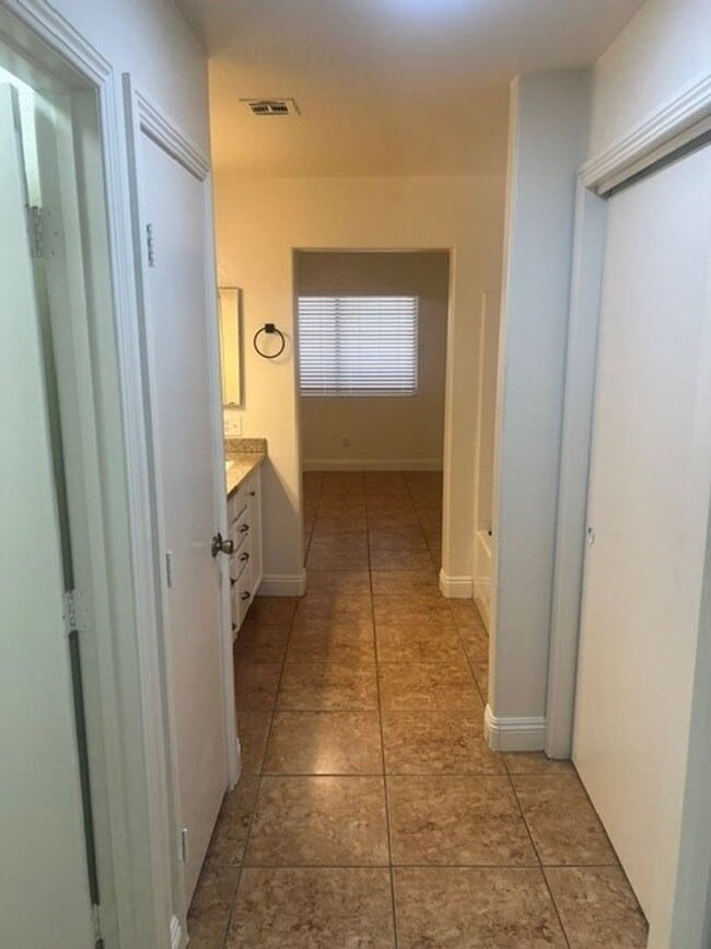 Photo - This three bedroom has the primary bedroom on the downstairs level.