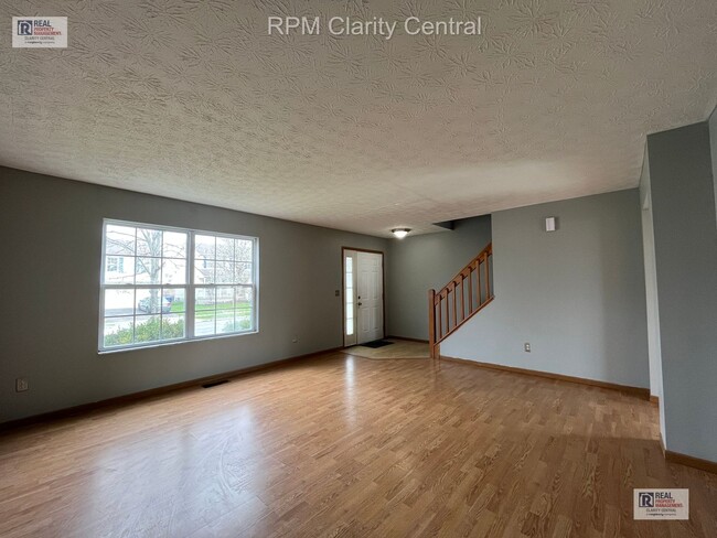 Photo - Spacious 4-Bedroom Home with Fenced Backyard, Deck, and 2-Car Garage