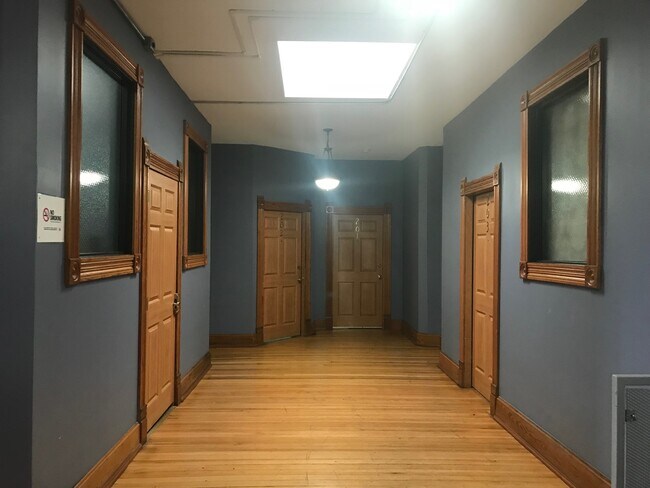 Skylight above East side hallway. Studio is first door on the right. - 605 Forest Ave Apartments Unit 203
