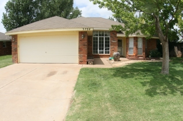 Building Photo - Brick 3 Bedroom Home! Stunning Backyard! M...