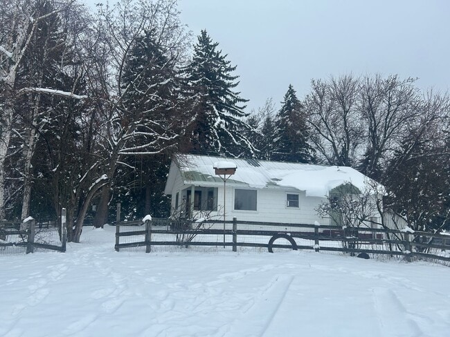 Building Photo - Bigfork Rodeo Farmhouse~ Fenced garden, greenhouse, garage, barn and shop!