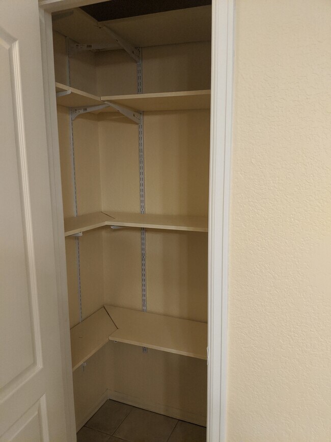 Roomy pantry with lots of shelving. - 8101 Elk Ln Unit 8101 Elk Ln