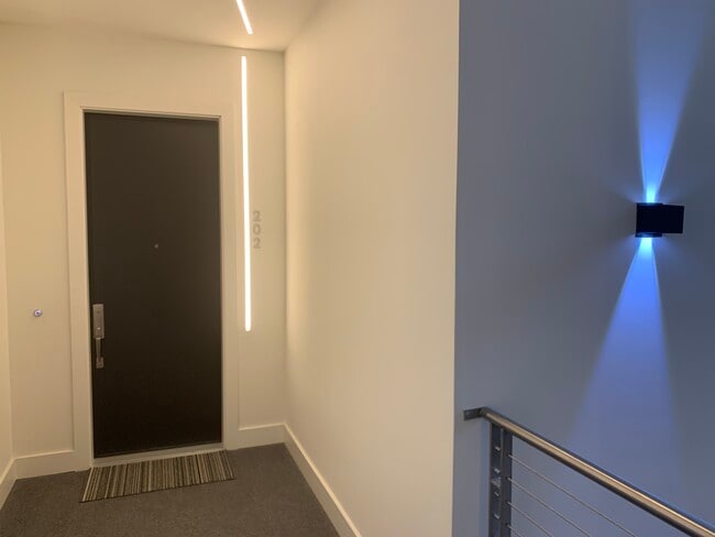 Solid core doors throughout home with added security strike plate on front door - 3923 Cole Ave Unit 202