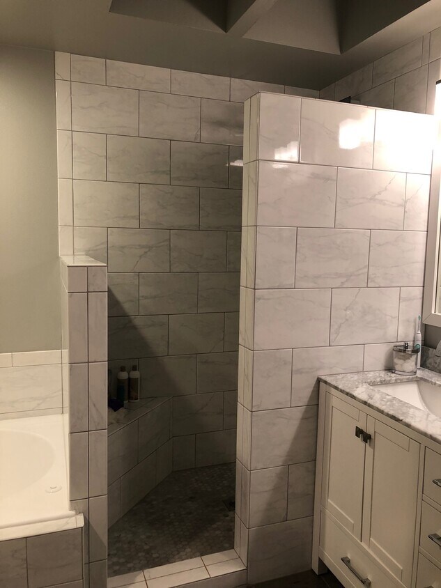 fully remodeled master bathroom with granite and tile and sky light. - 9915 NE 124th St (Kirkland, WA)