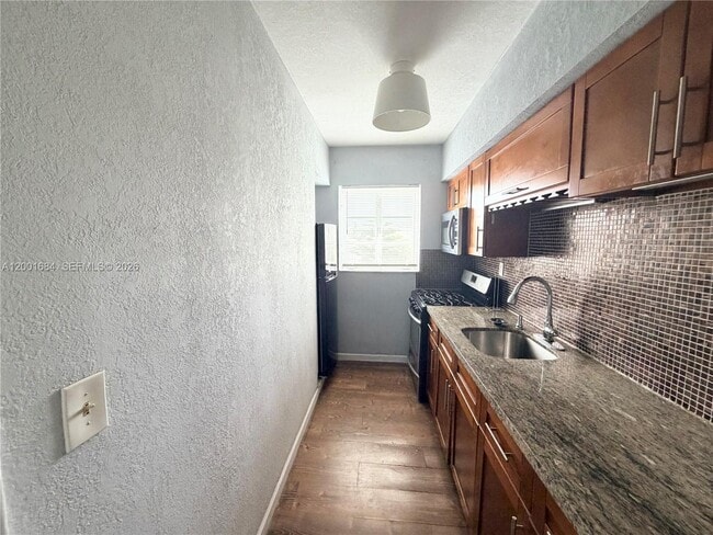 Building Photo - 620 84th St Unit 25