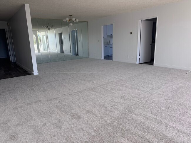 Living room looking in to dining room, kitchen and entry hall