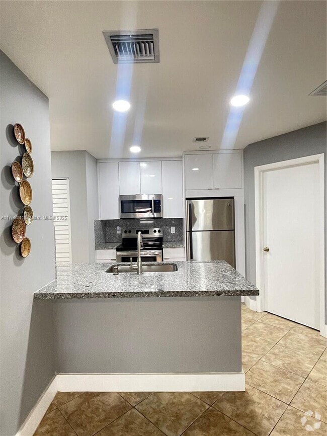 Building Photo - 18310 NW 68th Ave Unit D Rental