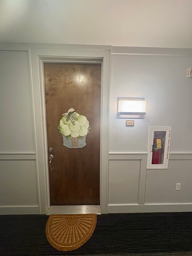Front door with enclosed hallway with A/C and heat - 200 Manufacturers Rd Unit 328