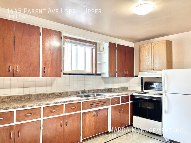 Building Photo - SPACIOUS 1 BEDROOM/1 BATH Unit Upper