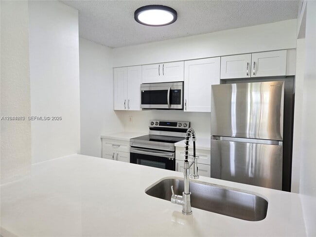 Building Photo - 2890 N Oakland Forest Dr Unit 102