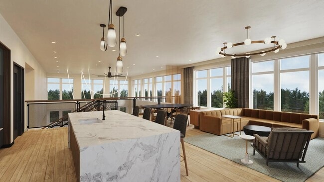 2nd-floor rooftop lounge at Modera Shoreline apartments features a demonstration kitchen, dining area, and comfortable seating. - Modera Shoreline