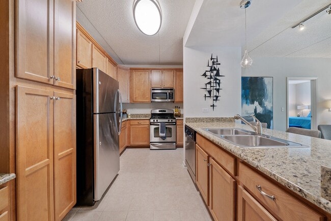 Kitchen with granite counters and pendant lighting