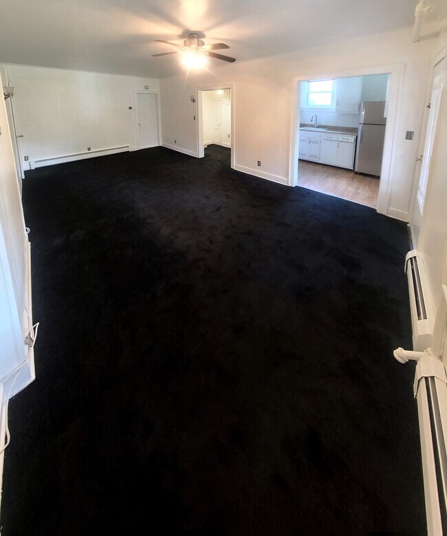 New Carpet in a wide living/dining room w/plenty of natural
