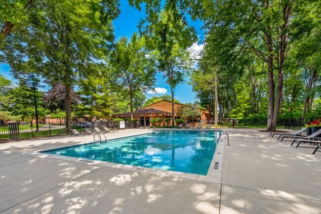 Heated swimming pool with sundeck at Eastwood Village Apartments in Clinton Township, MI.