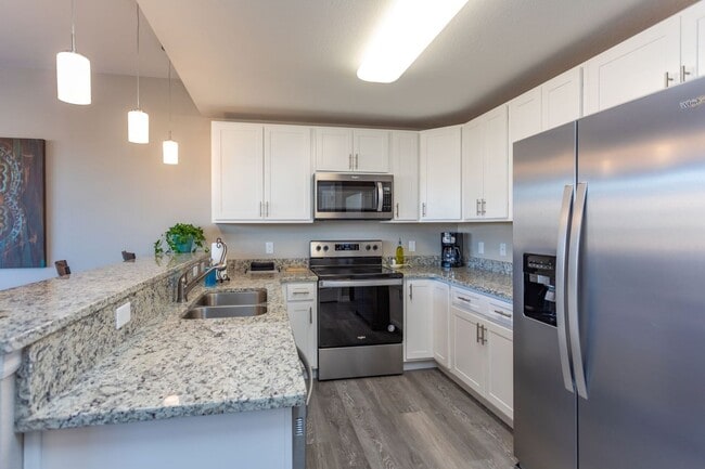 Photo - Stylish 3-Bedroom Townhome with Fireplace, Modern Kitchen & Spacious Layout!