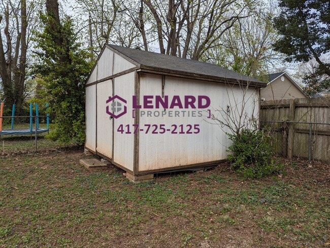 Photo - Charming 3-Bedroom Home with Fenced Yard & 2-Car Garage in Springfield