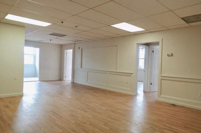 SPACIOUS FAMILY ROOM — A bright, comfortable central living space with convenient access to the kitc