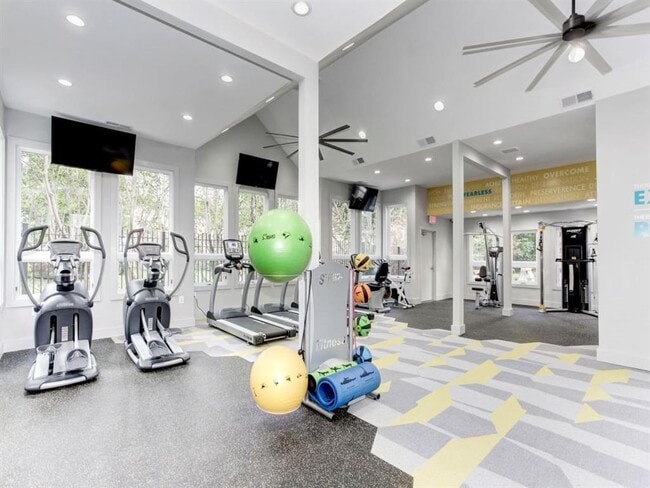 24-Hour Fitness Center with Cardio Machines, Free Weights, and Yoga Area