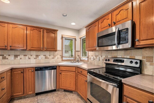 Photo - 4 Bed 3 Bath Ranch Style Home with Backyard Pond!