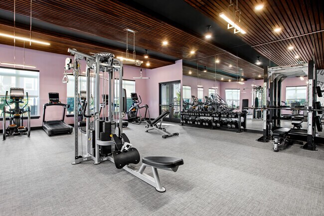 Stay active with a fully equipped fitness center right at home. - Lofts at Highlands